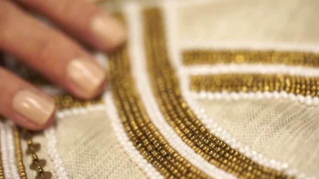 Embroidered fabric with beads for background