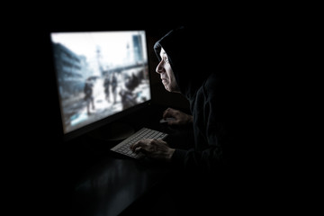 Young gamer in the dark