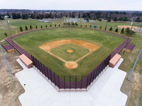 Ariel Photo Of Baseball Field In A Park On A Cloudy Day During Spring