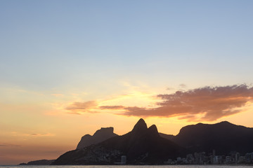 Silhouette of the hills of Rio de Janeiro and Ipanema beach in Rio de Janeiro during sunset