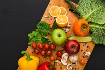 Frame of fresh vegetables on wooden background with copy space