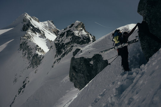 ski mountaineer climbing towards a ridge