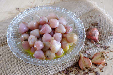 Raw and cooked lampascioni, traditional Italian wild food