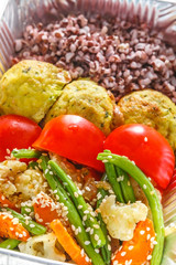 Healthy food in boxes, diet concept. Falafel