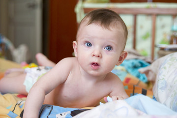 baby on the bed in her room