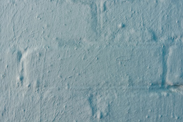 Close up brick wall painted in blue