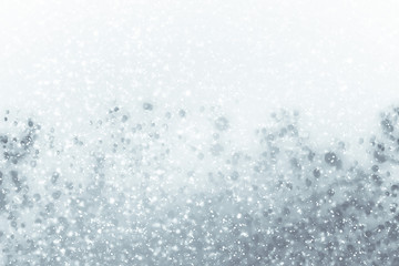 Abstract silver background with white particles. Round bokeh or glitter lights. Design template
