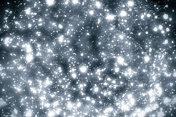 Abstract silver background with white particles. Round bokeh or glitter lights. Design template