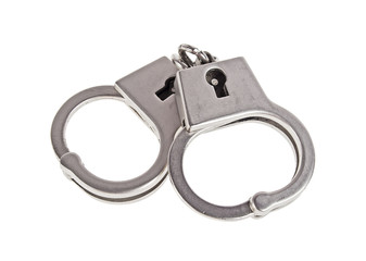 Silver handcuffs on a white background