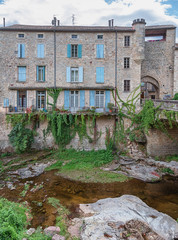 Fototapeta na wymiar River along the old town Largentiere