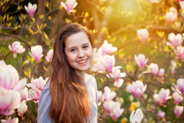 Naklejka premium Young teenager girl in the spring park