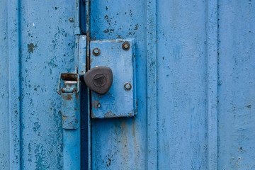 Close up old garage gate lock