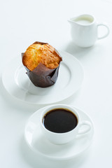 Breakfast. Coffee with milk and muffin.