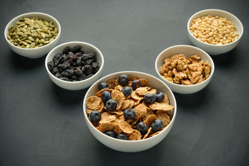 Healthy food. Multi grain flakes with blueberry, nuts for breakfast.