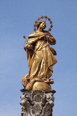 Fototapeta na wymiar Virgin Mary statue, Plague column at Main Square of the city of Maribor in Slovenia, Europe. Historical religious sculpture.
