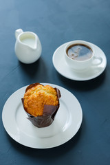 Breakfast. Muffin with coffee and milk.