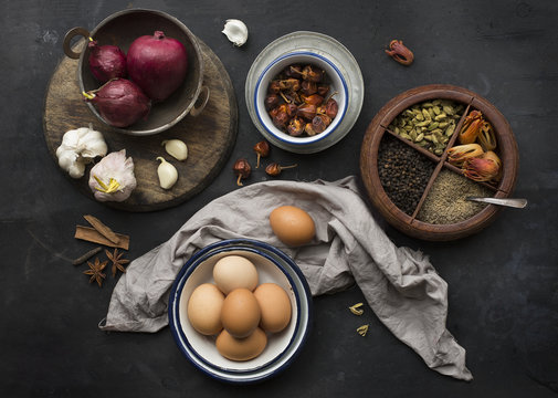 Still life of eggs, onions and herbs, close up 