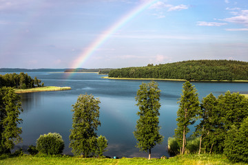 Rainbow in summer over the Stroust lake in Braslav region of Belarus.