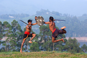 Weapon combat during Kalaripayattu Martial Art demonstration in Kerala, India