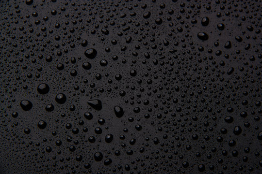 Drops of water on a black background.