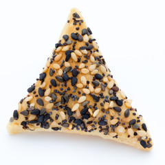 Crisps with nuts and seeds stacked on a white background.