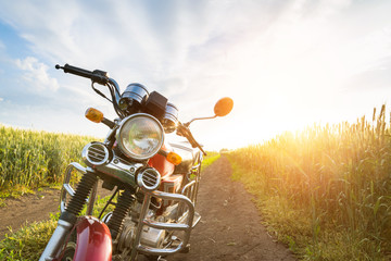 Fototapeta na wymiar Summer landscape road, wheat field, motocycle