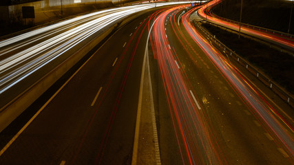 Fototapeta na wymiar Rays of lights, car lights on a road, at night