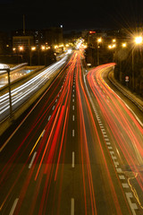 Rays of lights, car lights on a road, at night