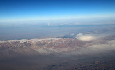 Mongolia aerial view of mountains covered with snow in the winter