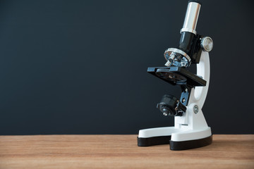 microscope on wooden table