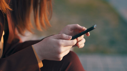 woman looking into the phone