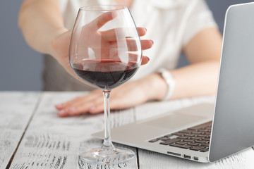 woman refuses to drink a wine