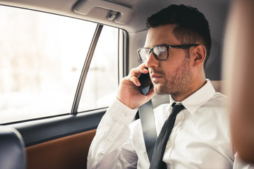 Handsome businessman in car