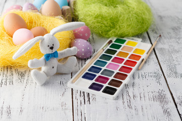 Easter bunny and pastel color egg. Kid creative workplace