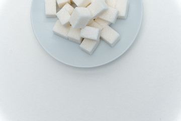 sugar cubes marshmallow plate white background