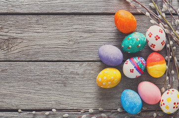 Colorful easter eggs on wood background