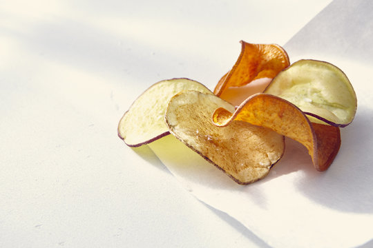 Potato chips on white