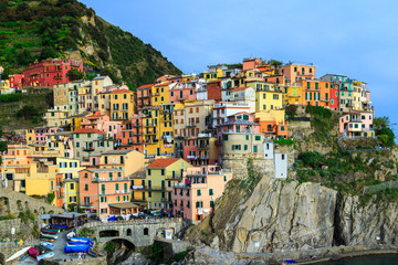 Fototapeta na wymiar Colorful traditional houses on a rock over Mediterranean sea, Manarola, Cinque Terre, Italy
