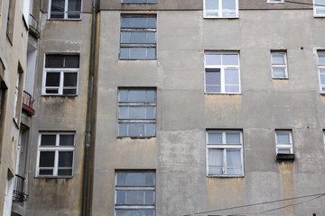 The facade of the old abandoned house with windows
