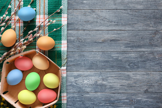 Colorful easter eggs on wood background
