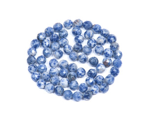 Faceted round beads of blue and white sodalite from Africa isolated on white background