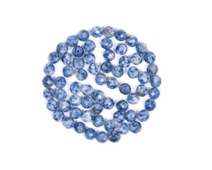 Faceted round beads of blue and white sodalite from Africa isolated on white background