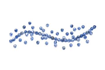 Faceted round beads of blue and white sodalite from Africa isolated on white background