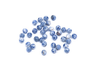 Faceted round beads of blue and white sodalite from Africa isolated on white background