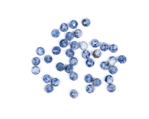 Faceted round beads of blue and white sodalite from Africa isolated on white background