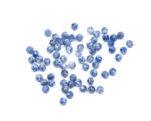 Faceted round beads of blue and white sodalite from Africa isolated on white background