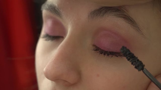 Pink Eye make-up Stock Footage. Model: Mary