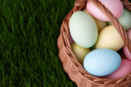 Colorful Easter Eggs Basket In A Grass Meadow