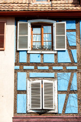 French provencal style blue house with windows. Alsace, France.
