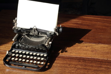 Vintage typewriter on wooden desk contact me